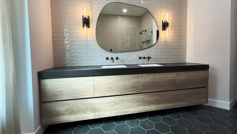anm-contracting-projects-custom-wooden-bathroom-counterbase-with-black-countertop-and-dual-vanity-wiith-wall-mirror